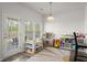 Bright play area with lots of light, toys, and access to the backyard at 5222 American Holly Ln, Ladson, SC 29456