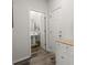 Clean powder room with a pedestal sink and wood-look flooring at 5222 American Holly Ln, Ladson, SC 29456