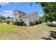 Spacious backyard with lush greenery, offering privacy and space for outdoor activities and relaxation at 5400 Turning Tide, North Charleston, SC 29420