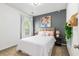 Bedroom with a light-colored bed with several pillows and neutral walls at 5400 Turning Tide, North Charleston, SC 29420