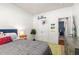 Bright bedroom features a twin bed, neutral walls, and a geometric rug at 5400 Turning Tide, North Charleston, SC 29420