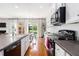 Bright kitchen featuring white cabinetry, stainless steel appliances, and an island with a breakfast bar at 5400 Turning Tide, North Charleston, SC 29420