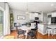 Cozy breakfast nook adjacent to the kitchen with a round table, stylish chairs, and lots of natural light at 5400 Turning Tide, North Charleston, SC 29420