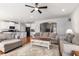 Open concept living room features stylish furnishings and seamless flow into the kitchen and dining areas at 5400 Turning Tide, North Charleston, SC 29420