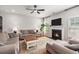 Comfortable living room with a fireplace, plush seating, and a large window for natural light at 5400 Turning Tide, North Charleston, SC 29420