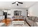 Cozy living room with hardwood floors, a ceiling fan, and comfortable seating arrangements at 5400 Turning Tide, North Charleston, SC 29420