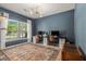 Home office featuring large windows, dual workstations, a patterned rug, and contemporary lighting at 5400 Turning Tide, North Charleston, SC 29420