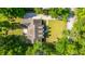 Aerial shot of house and landscaped yard in a leafy green residential neighborhood at 5692 Barbary Coast Rd, Hollywood, SC 29449
