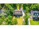 Aerial image showcasing a home with manicured lawns and a private driveway at 5692 Barbary Coast Rd, Hollywood, SC 29449