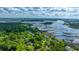 Expansive aerial view in Charleston, SC, showcasing marsh and water views and lush green trees at 5692 Barbary Coast Rd, Hollywood, SC 29449