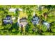 Bird's eye view of homes, showcasing lawns, roofs and landscaping in a lush residential neighborhood at 5692 Barbary Coast Rd, Hollywood, SC 29449