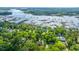 Picturesque aerial view of waterfront homes, private docks, and lush green trees at 5692 Barbary Coast Rd, Hollywood, SC 29449