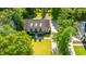 Aerial image showcasing a home with manicured lawns and a private driveway at 5692 Barbary Coast Rd, Hollywood, SC 29449