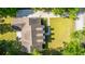 Overhead shot of house, yard and patio in a lush, tree-filled residential neighborhood at 5692 Barbary Coast Rd, Hollywood, SC 29449