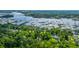 Picturesque aerial view of waterfront homes, private docks, and lush green trees at 5692 Barbary Coast Rd, Hollywood, SC 29449