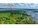 Scenic aerial view of the property and neighborhood featuring beautiful waterfront and marsh views in Charleston, SC at 5692 Barbary Coast Rd, Hollywood, SC 29449