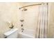 Bathroom featuring a shower/bath, neutral patterned wallpaper, and stylish fixtures at 5692 Barbary Coast Rd, Hollywood, SC 29449
