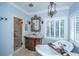 Beautiful bathroom with a freestanding tub, glass-enclosed shower, and ornate mirror at 5692 Barbary Coast Rd, Hollywood, SC 29449