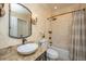 Bathroom features patterned wallpaper, an oval mirror, an ornate sink, and a shower/bath at 5692 Barbary Coast Rd, Hollywood, SC 29449