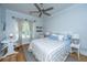 Cozy bedroom with a queen-size bed, ample natural light, and ceiling fan at 5692 Barbary Coast Rd, Hollywood, SC 29449