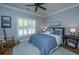 Bedroom featuring a ceiling fan, a window with shutters, and simple decor at 5692 Barbary Coast Rd, Hollywood, SC 29449