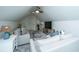 Cozy bonus room with vaulted ceilings, plush seating, and a modern ceiling fan for added comfort at 5692 Barbary Coast Rd, Hollywood, SC 29449