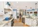 Modern kitchen features stainless appliances, granite counters, and open layout at 5692 Barbary Coast Rd, Hollywood, SC 29449