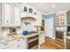 Stylish kitchen with granite countertops, stainless steel appliances, and classic white cabinetry at 5692 Barbary Coast Rd, Hollywood, SC 29449