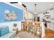 Elegant kitchen featuring a breakfast bar with seating, white cabinetry, and modern lighting at 5692 Barbary Coast Rd, Hollywood, SC 29449