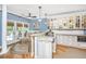 Well-equipped kitchen with granite countertops, island seating, and lots of natural light at 5692 Barbary Coast Rd, Hollywood, SC 29449