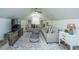 Cozy living room featuring stylish furniture, a ceiling fan, and large windows at 5692 Barbary Coast Rd, Hollywood, SC 29449