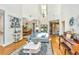 Airy living room with high ceilings, wood floors and large windows for natural light at 5692 Barbary Coast Rd, Hollywood, SC 29449