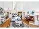 Open concept living room features high ceilings, hardwood floors, and stylish decor at 5692 Barbary Coast Rd, Hollywood, SC 29449