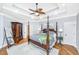 Inviting main bedroom featuring a four-poster bed, hardwood floors, and stylish decor at 5692 Barbary Coast Rd, Hollywood, SC 29449