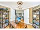 Bright office featuring double doors, built-in shelving, and a rich wood desk at 5692 Barbary Coast Rd, Hollywood, SC 29449