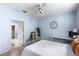 Airy bedroom with a ceiling fan, round decorative mirror, and white desk at 60 Fenwick # 936, Johns Island, SC 29455