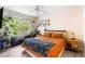 Cozy bedroom with a ceiling fan, large windows and wood-look flooring at 60 Fenwick # 936, Johns Island, SC 29455