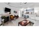 Cozy living room featuring a fireplace, vintage furniture, and a view of the kitchen at 60 Fenwick # 936, Johns Island, SC 29455
