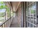 Long, covered brick balcony overlooking the trees with views of the neighborhood at 615 Fairington Dr, Summerville, SC 29485