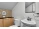 Compact bathroom features a wood-look vanity, a sink, and a wall-mounted mirror at 615 Fairington Dr, Summerville, SC 29485
