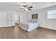 Bright bedroom featuring a ceiling fan, wood floors, closet and access to the bathroom at 615 Fairington Dr, Summerville, SC 29485