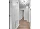 Hallway featuring wood floors, white walls, and doorways to other rooms at 615 Fairington Dr, Summerville, SC 29485