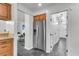 Kitchen area featuring stainless steel refrigerator and an adjacent view into the living room and hallway at 615 Fairington Dr, Summerville, SC 29485