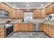Kitchen boasts stainless steel appliances, granite countertops, and custom cabinets for a modern culinary experience at 615 Fairington Dr, Summerville, SC 29485