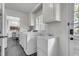 Bright laundry room with modern appliances and plenty of storage cabinets at 615 Fairington Dr, Summerville, SC 29485