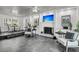 Modern living room featuring a fireplace, tile flooring, and large windows for natural light at 615 Fairington Dr, Summerville, SC 29485