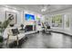 Bright living room with tile floors, a fireplace and a large bay window bringing in plenty of natural light at 615 Fairington Dr, Summerville, SC 29485