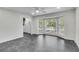 Inviting living area featuring bay window, white door, and dark tile floors at 615 Fairington Dr, Summerville, SC 29485