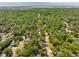Drone shot of neighborhood with tree-lined streets and mature landscaping at 620 Clearview Dr, Charleston, SC 29412