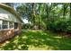 Expansive backyard featuring a lush lawn and mature trees, perfect for outdoor activities at 620 Clearview Dr, Charleston, SC 29412